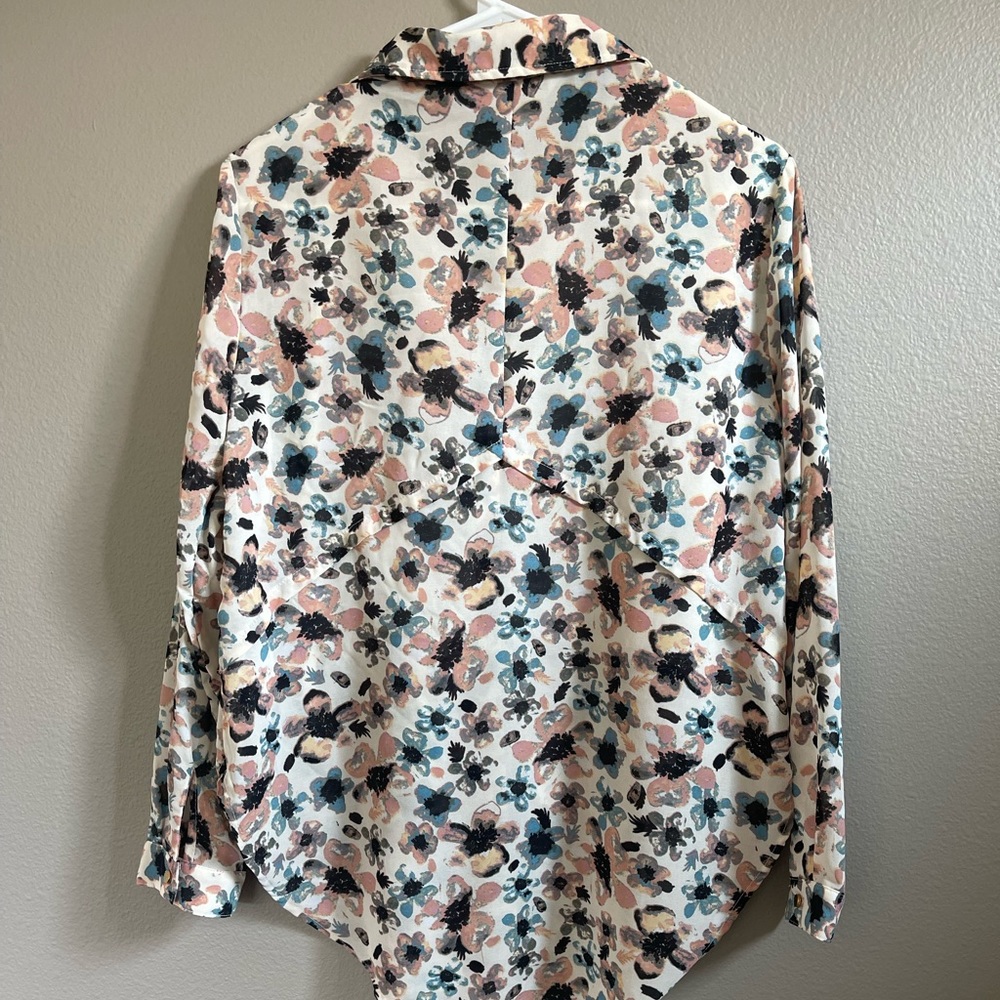 Floral blouse, gold buttons, never warn